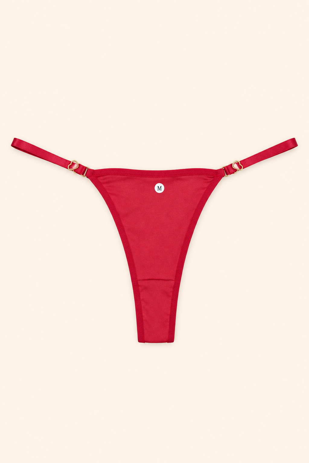 Fio dental vermelho com argolas - fundo off-white pêssego